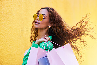 Buy stock photo Classy, retail and portrait of a woman with shopping bags for fashion, luxury sale and discount. Elegant, customer and rich girl in the city to shop, buying clothes and fashionable clothing on a wall