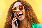 Phone call, sunglasses and woman laughing on yellow background, color wall or backdrop. Happy trendy female talking on smartphone with mobile technology, shades and communication, contact and network