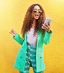 Fashion, phone and happy woman by a wall in the city while on a vacation or weekend trip. Travel, style and excited female from Brazil with a stylish, trendy and cool outfit networking on a cellphone