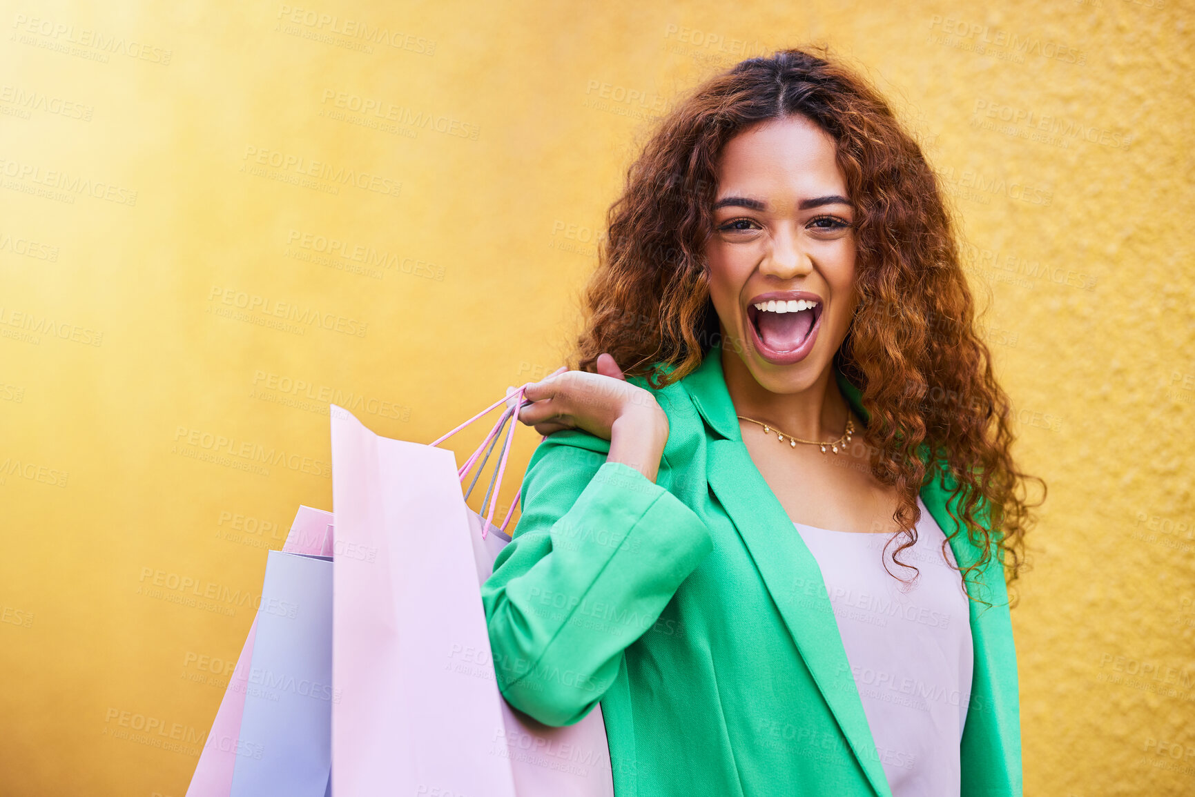 Buy stock photo Shopping bag, portrait and wow of woman winning, success and promotion sale isolated on wall background. Retail, fashion and excited winner, funky model or black person for clothes celebration mockup