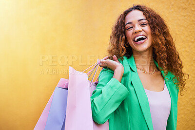 Buy stock photo Shopping bag, portrait and black woman with beauty success, fashion sale or promotion isolated on wall background. Retail, wealth and excited funky model or person with clothes celebration mockup