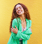 Black woman, fashion and self love on yellow wall background for motivation, beauty and style. Gen z Colombia person with curly hair outdoor for freedom, hug and positive mindset for Opportunity