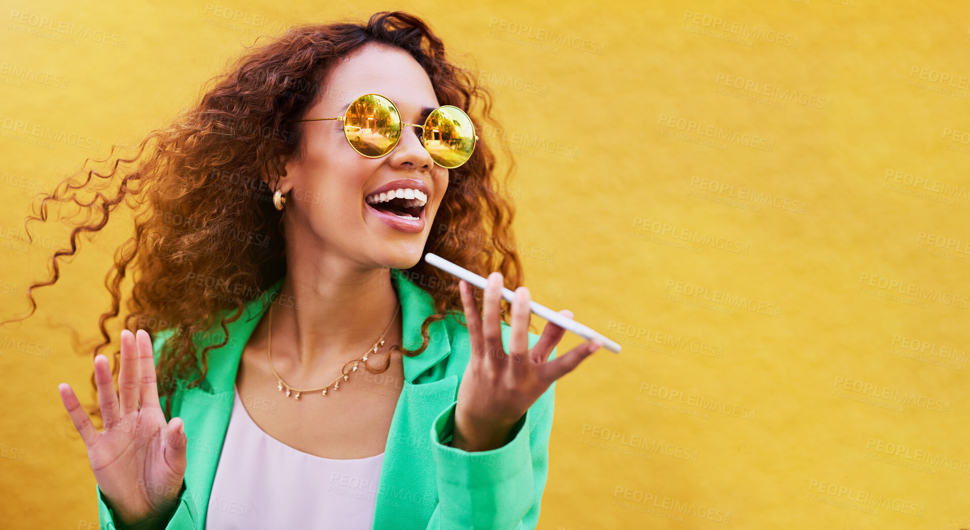 Buy stock photo Audio message, technology and woman on a phone call for communication, connection and chat. Voice assistant, mockup and rich fancy girl speaking on a mobile for discussion and talking on a city wall