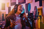 Recording, music and woman singing in a studio for radio, song production and rehearsal. Creative, voice and singer making a record, track or musical sound with a talent as a professional artist