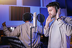 Musician, headphones or singing microphone in neon studio for album recording, night performance or radio media industry. Men, singer or artist friends in production collaboration, theater or karaoke