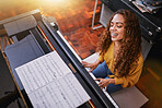 Woman, singing and playing piano with music notes and a smile in home for musician talent and keys. Young person, artist or singer happy about performance and sound of voice and instrument