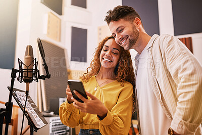 Buy stock photo Man, woman or phone in recording studio for song lyrics, podcast ideas or album cover art in production booth. Smile, happy or musician on mobile technology for friends, singer or media collaboration