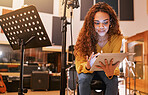Musician, woman or tablet for song writing in recording studio for album, night performance or radio industry. Smile, happy or singer on technology for artist singing lyrics, production or research