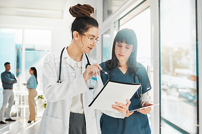 Buy stock photo Woman, doctor and team with document in planning, strategy or ideas by window for healthcare notes at clinic. Female doctors or nurse checking paperwork together for medical information at hospital