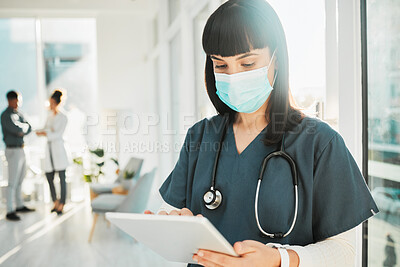 Buy stock photo Doctor, woman with face mask and tablet, health with digital medical information or research with stethoscope in hospital. Covid, safety and electronic healthcare data with female in ppe and tech