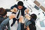 Collaboration, teamwork and above business people holding hands in support of vision, growth or training in office. Team building, group and hand unity in motivation, partnership or corporate startup