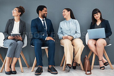 Buy stock photo Talking, recruitment and business people in waiting room for interview with human resources. Hr hiring, job and group of candidates, men and women laughing with devices in company for employment.