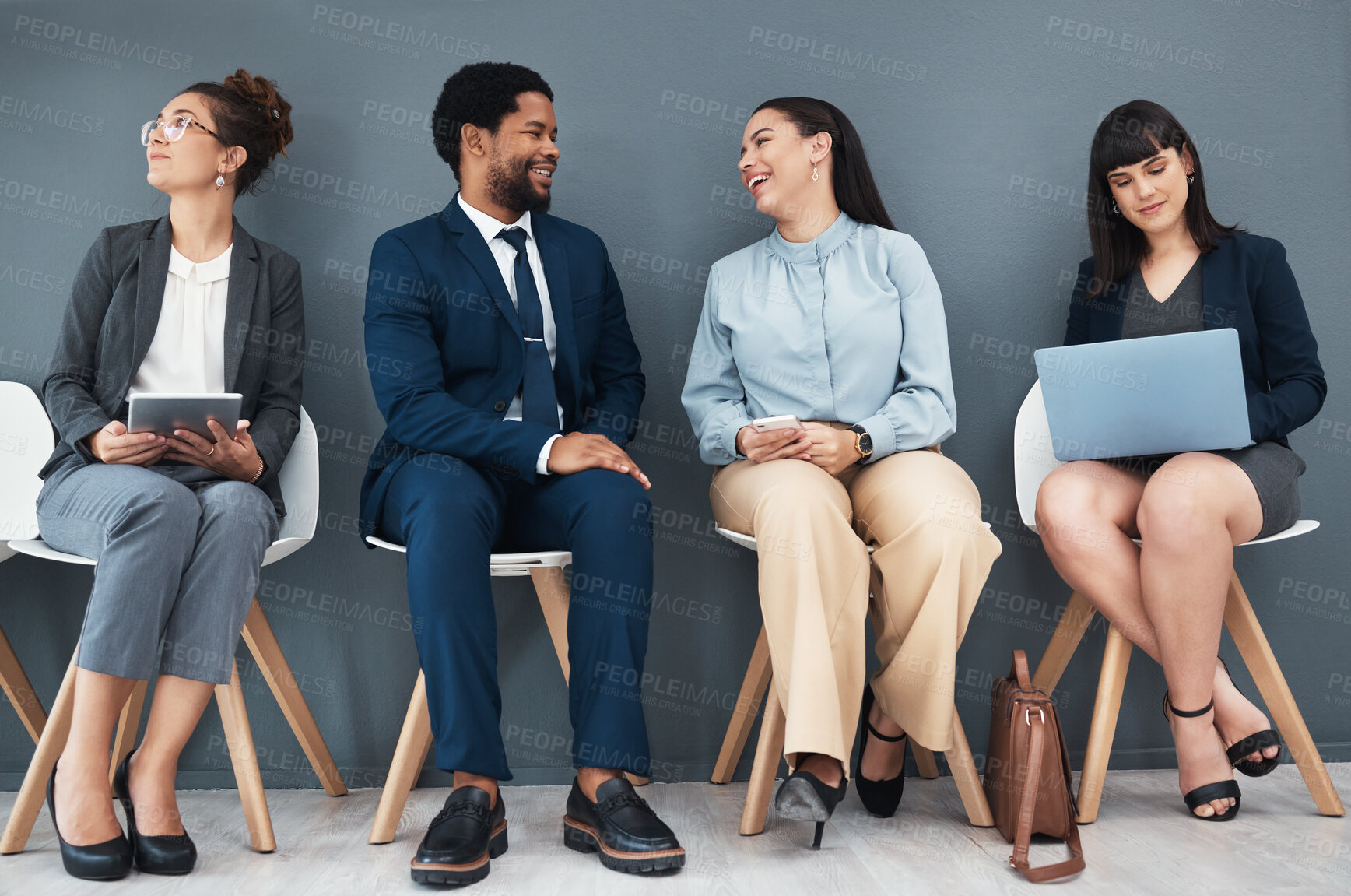 Buy stock photo Talking, recruitment and business people in waiting room for interview with human resources. Hr hiring, job and group of candidates, men and women laughing with devices in company for employment.