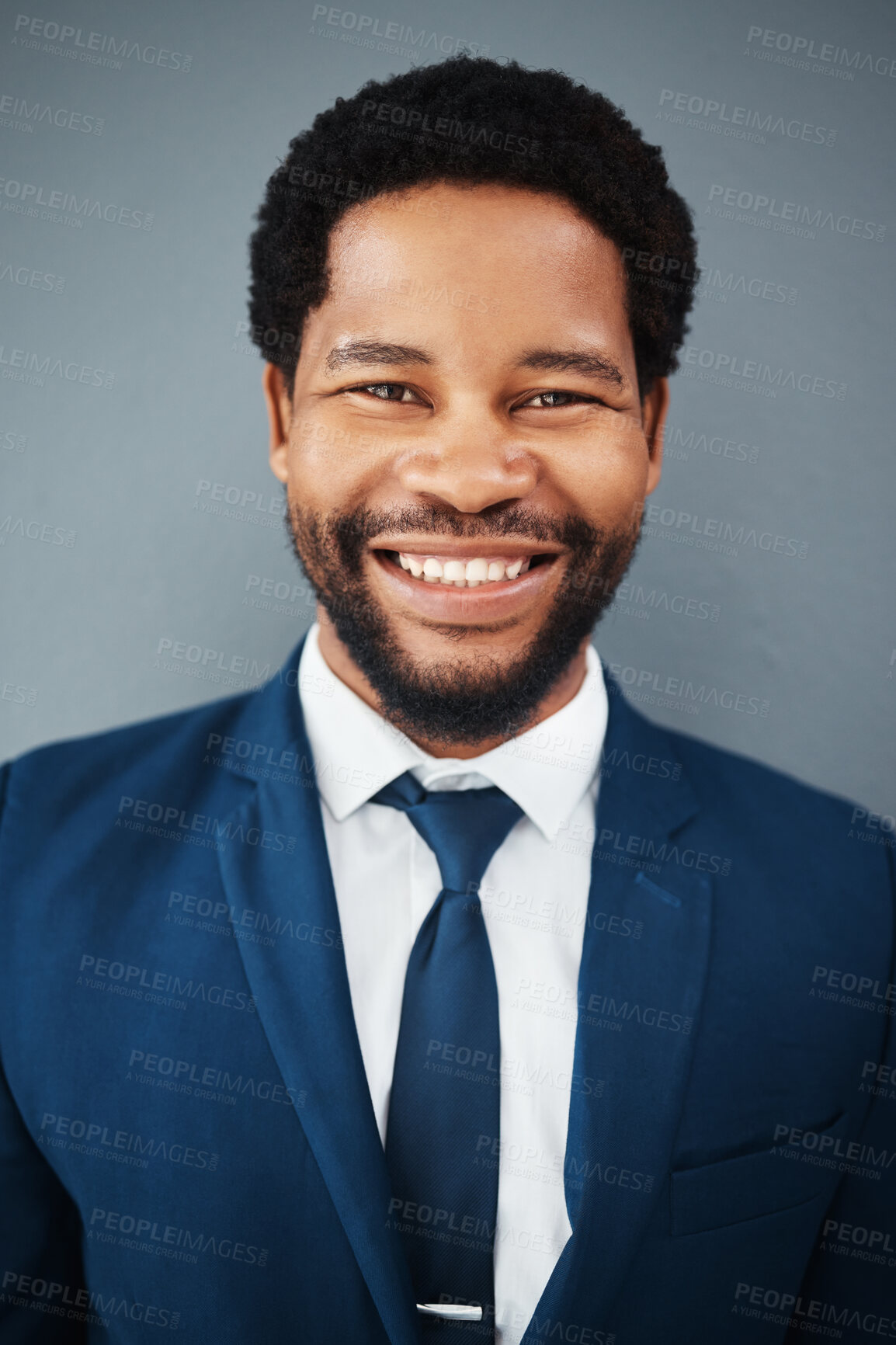 Buy stock photo Portrait, business and smile of black man in office, studio and company with career, mission and success mindset. Ceo, boss face and happy, confident and proud male entrepreneur from Nigeria.