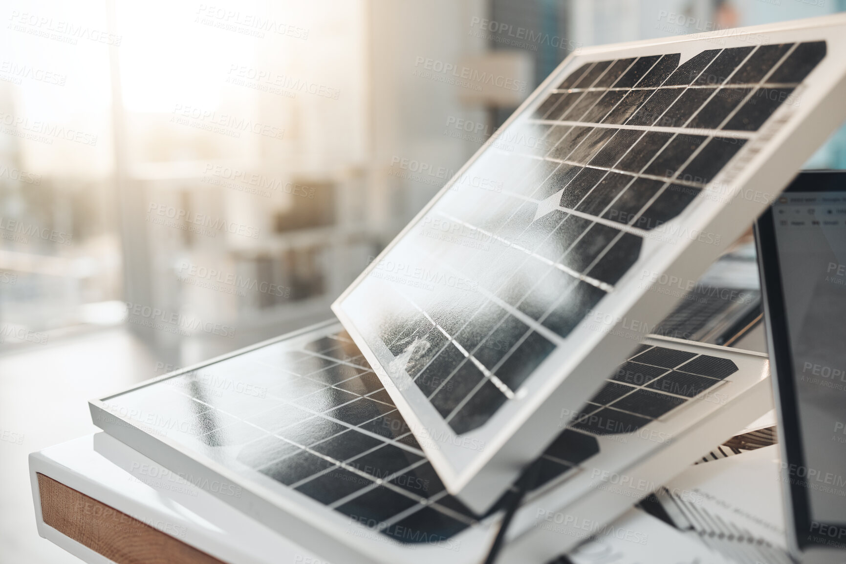 Buy stock photo Solar panel, office and design on desk for renewable energy, electricity tech or engineering innovation. Photovoltaic, eco friendly or sustainability for construction, goal or electric infrastructure