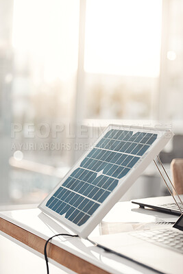 Buy stock photo Solar panel, office and design on table for renewable energy, electricity tech or engineering innovation. Photovoltaic, eco friendly or sustainable charge for laptop, job and electric infrastructure