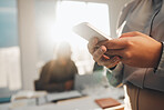 Business woman, hands typing and teamwork meeting with a female employee on a mobile app. Office, lens flare and online chat of a financial analytics worker on a cellphone reading website content