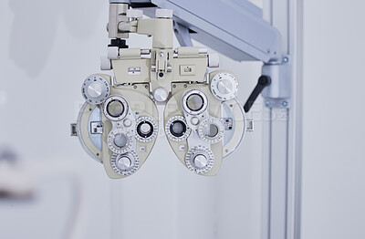 Buy stock photo Phoropter, medical optometry and equipment in hospital for eye test or examination. Vision, healthcare and technology or tools for ophthalmology for eyecare, health and eyesight wellness in clinic.