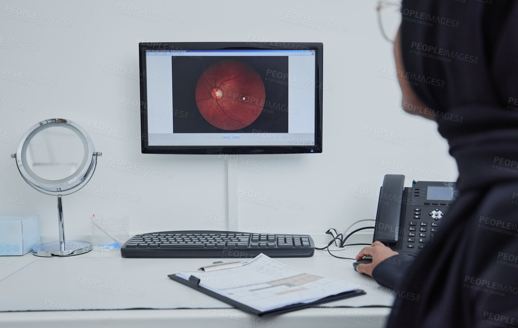 Buy stock photo Eye analysis, optometry and a doctor with a computer for research on a retina and lens problem. Ophthalmology, technology and Muslim woman looking at a monitor screen for eyesight and optic analytics