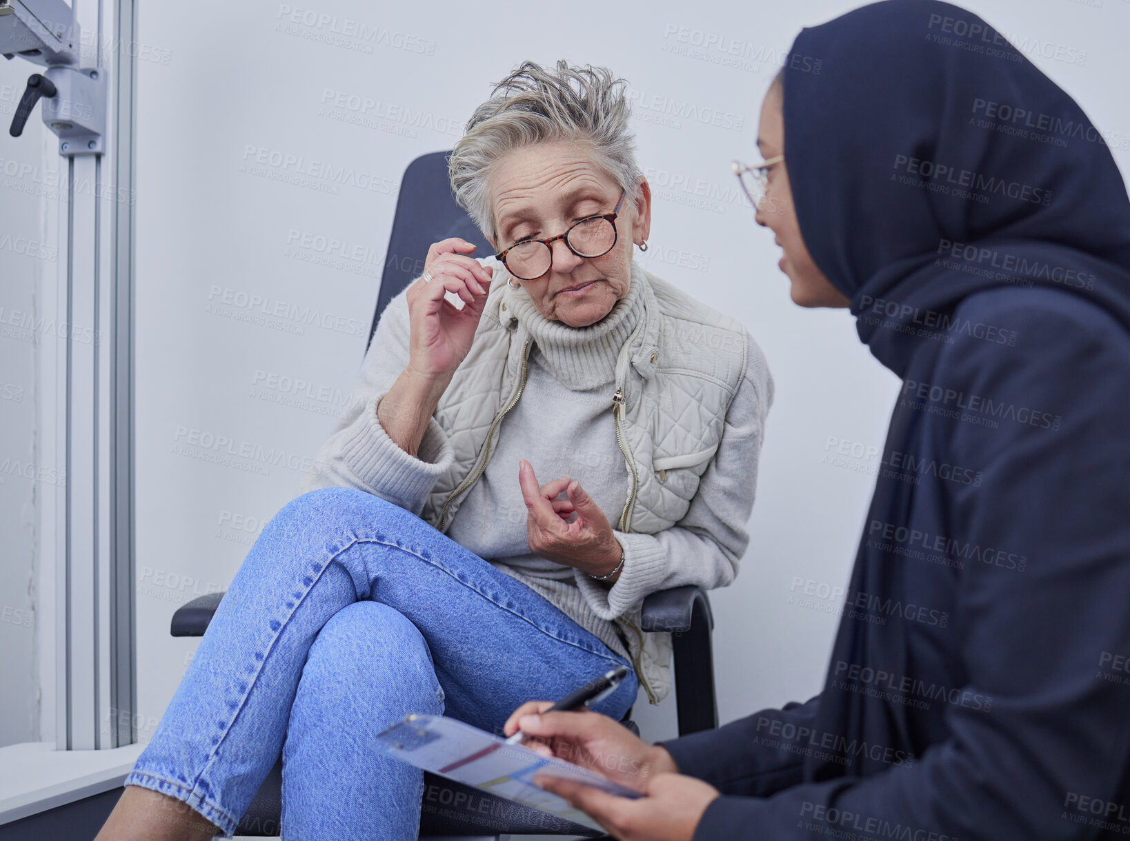 Buy stock photo Optometry, healthcare and woman filling in a form before doing a eye test in a optic clinic. Health insurance, ophthalmology and optician helping senior female patient with document in optical store.