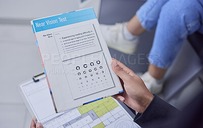 Buy stock photo Optometry, consulting and hand with a vision test, document and paper for an eye exam. Consultation, ophthalmology and optician with an optical examination for a patient for eyesight and glasses