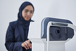 Optometry, ophthalmology and Muslim woman with a machine for vision correction and surgery. Test, technology and optician with device for examination of eyes, optical measurement and visual exam