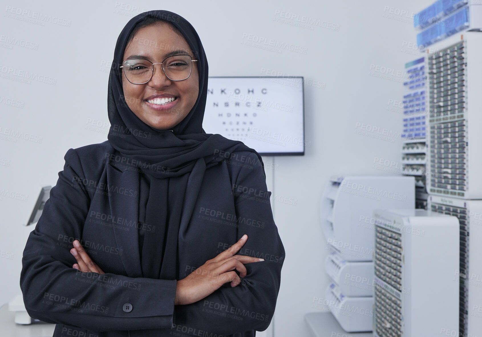 Buy stock photo Hijab, muslim woman portrait and optometrist in a doctor office ready for eye test with chart. Healthcare, eyes wellness and proud clinic worker with a smile with company vision and success 