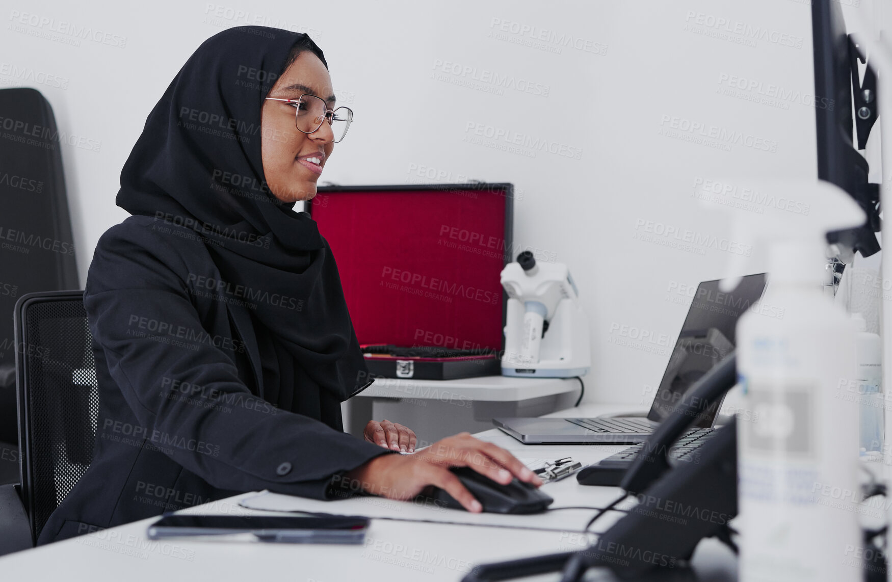 Buy stock photo Optometry, consulting and Muslim woman on a computer for research, healthcare and analytics. Ophthalmology, check and doctor reading information, eye results and analysis of medicare on a pc