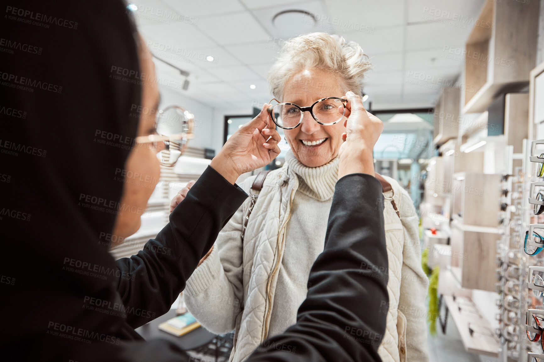 Buy stock photo Eyewear, vision and optometry with a senior woman in an optician office for prescription lenses. Glasses, eyesight and fashion with a mature customer buying new frame spectacles at the optometrist