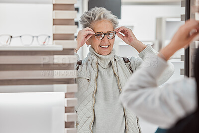 Buy stock photo Senior woman, glasses and eye care at mirror with patient shopping for vision lens or frame in optics shop. Happy customer person smile for decision on optometry product choice for eyes and wellness