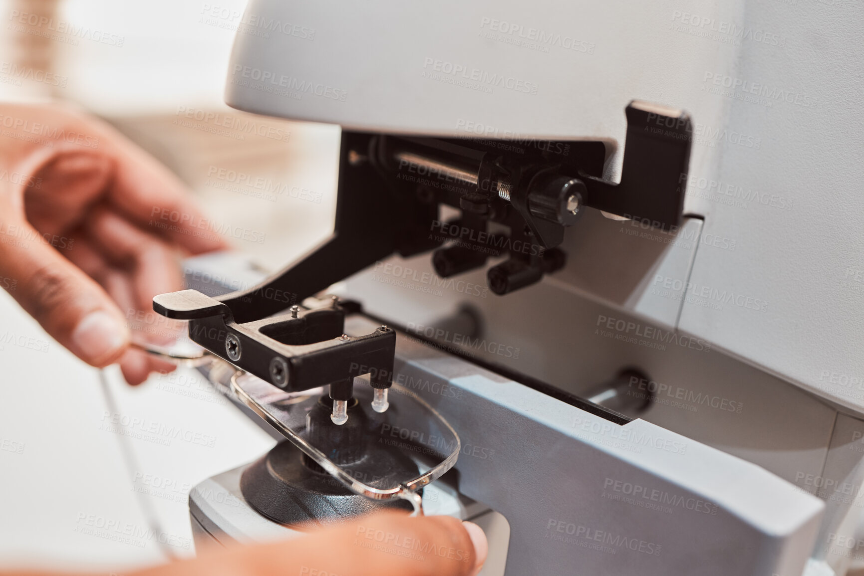 Buy stock photo Hands, glasses and equipment with an optometrist in the office to configure prescriptions lenses from above. Eyewear, healthcare and medical with a doctor at work to adjust new frame spectacles