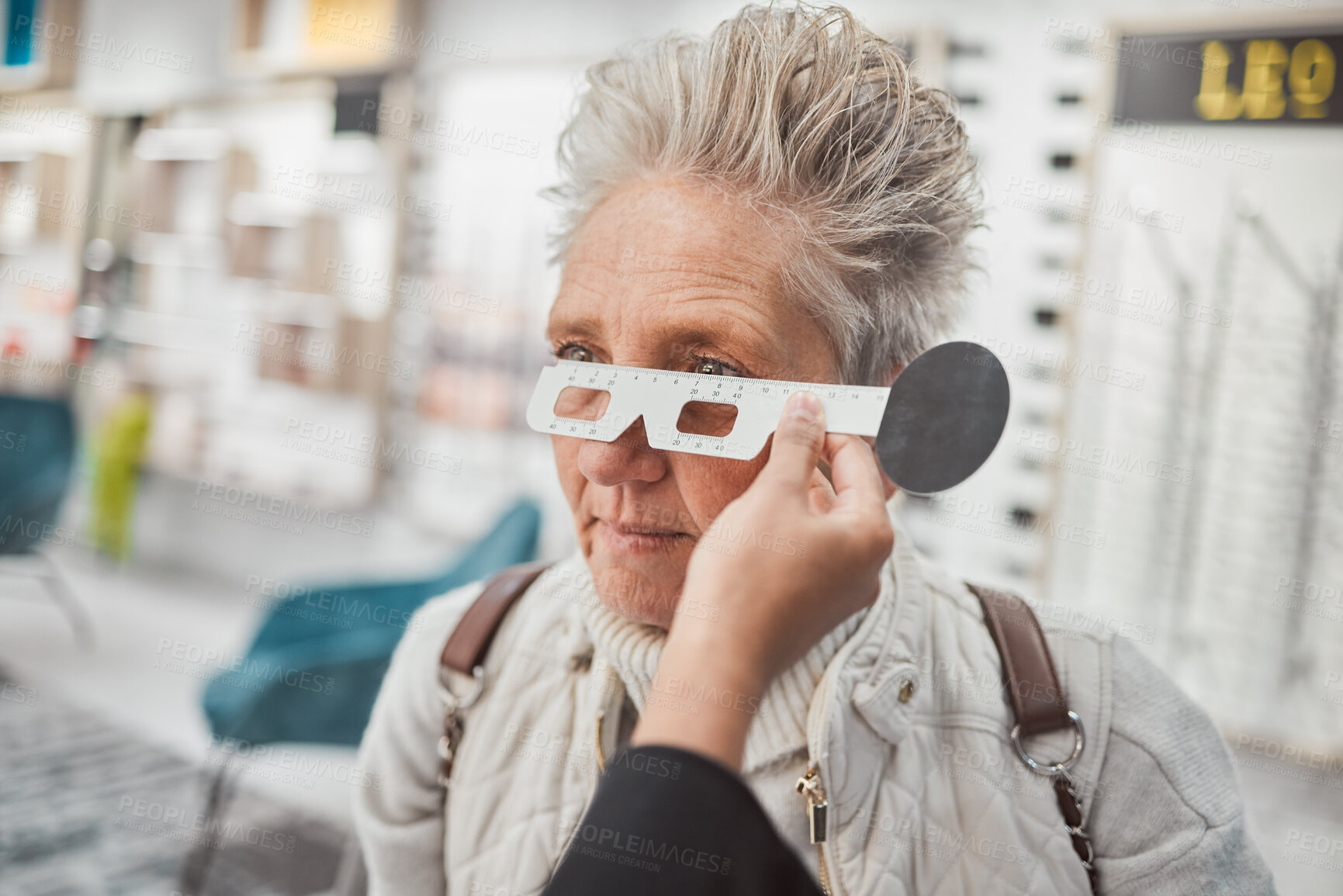 Buy stock photo Optometry, measurement and doctor testing eyes of a woman for glasses, frame fitting and eye distance. Healthcare, medical and mature patient with an optometrist to measure vision, lens and eyesight