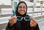 Optometry, portrait and Muslim woman with glasses for vision, help and shopping at a store. Working, retail and Islamic optician helping with eyewear fitting, consultation and eye care frame