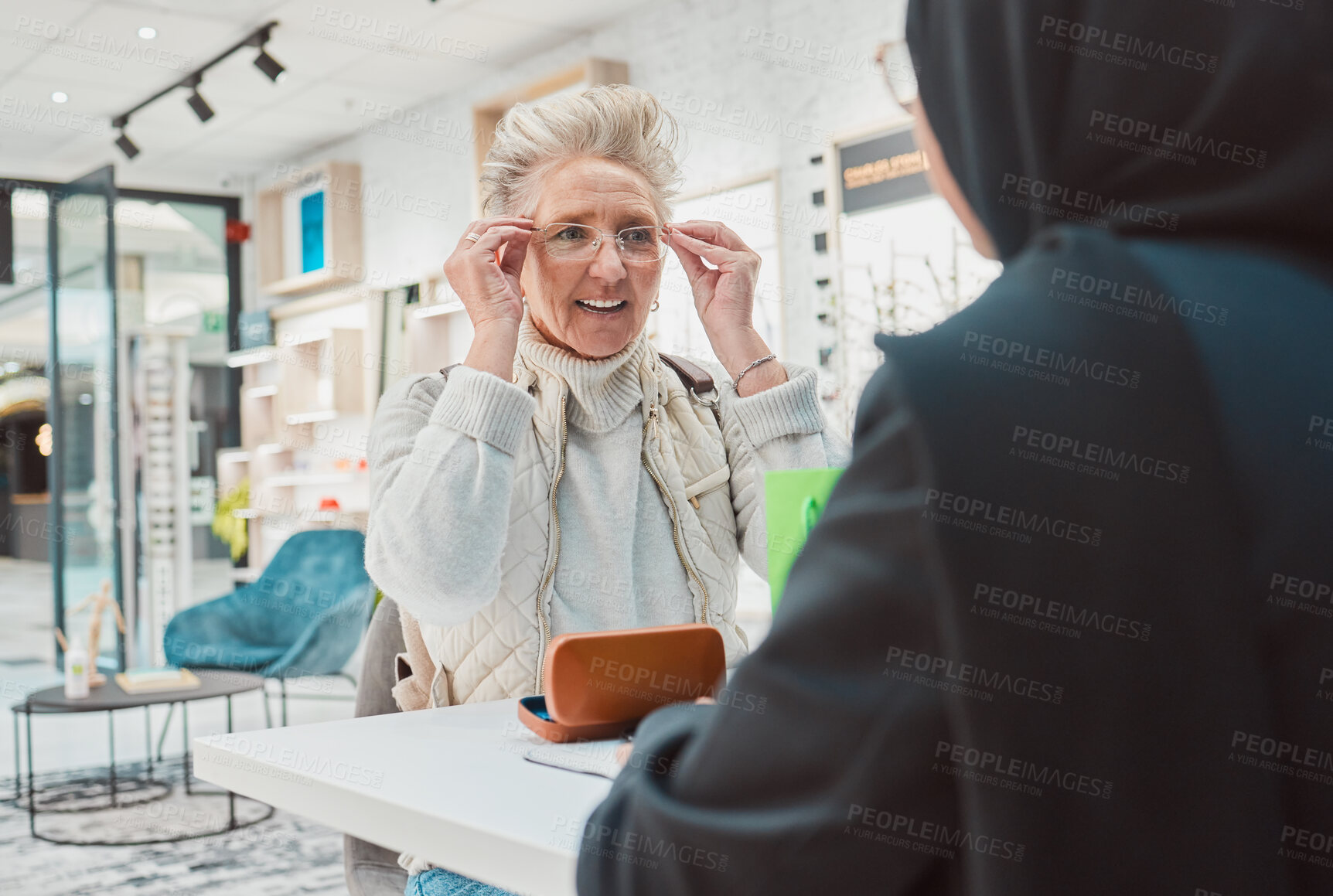 Buy stock photo Senior woman, glasses and eye care for a patient shopping for vision lens or frame in optics shop. Happy customer person with consultant for decision on optometry product choice for eyes and wellness