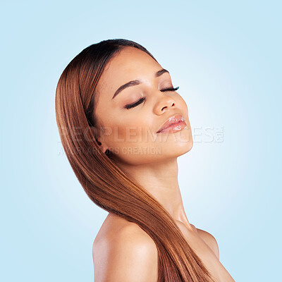 Buy stock photo Face, skincare and hair care of woman with eyes closed in studio isolated on a blue background. Makeup cosmetics, beauty and young female model with salon treatment for growth, hairstyle and balayage