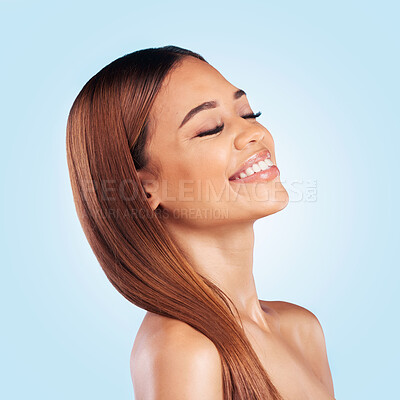 Buy stock photo Face, beauty and hair care of woman with eyes closed in studio isolated on a blue background. Makeup cosmetics, skincare and happy female model with salon treatment for growth, hairstyle and balayage