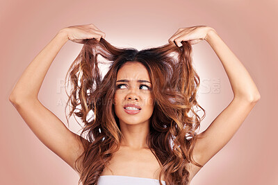 Buy stock photo Sad, beauty and hair loss of woman in studio isolated on a pink background for haircare. Hairstyle, face and confused female model with keratin problem, split ends and damage after salon treatment.