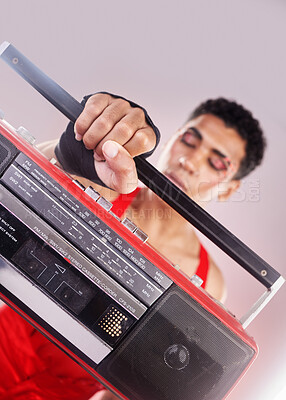 Buy stock photo Closeup, retro radio and black man with music, makeup and fashion against grey studio background. Zoom, boom box and cassette player with queer male, gay and transgender person with sounds and music