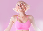 Fashion, style and portrait of happy cool woman in sportswear isolated against a studio pink background. Smile, fun and joyful model or person for fashionable exercise, workout or fitness