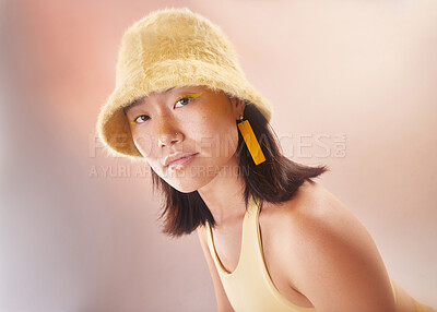 Buy stock photo Asian woman, fashion and makeup with gen z and portrait, yellow aesthetic and edgy on studio background. Streetwear, beauty and cosmetics with style, female face and young model with fog or smoke