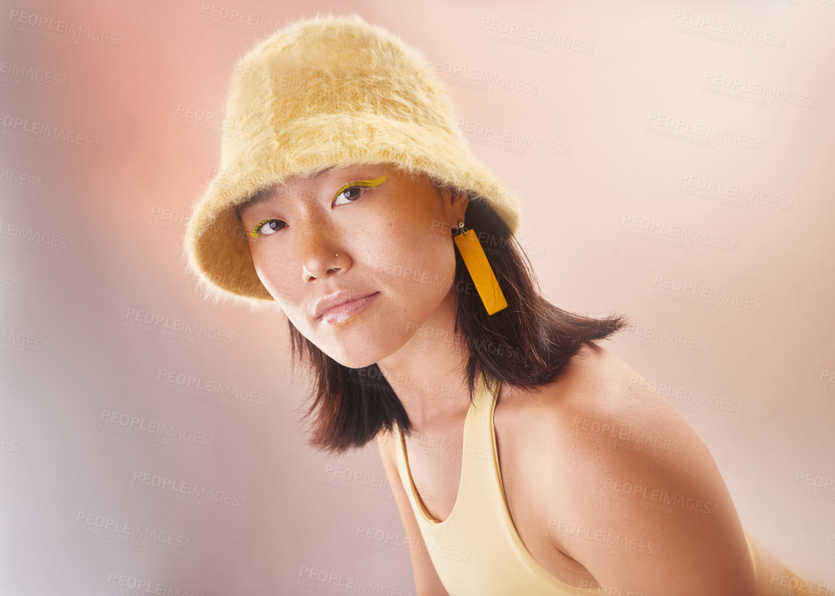 Buy stock photo Asian woman, fashion and makeup with gen z and portrait, yellow aesthetic and edgy on studio background. Streetwear, beauty and cosmetics with style, female face and young model with fog or smoke