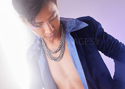 Buy stock photo Stylish, edgy and cyberpunk man with fashion isolated on a purple studio background. Creative, futuristic and serious Asian guy with expression through clothes, style and fashionable on a backdrop