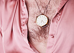 Watch, jewelry and fashion with a man model closeup in an open shirt showing his chest hair for 70s style. Jewellery, lgbt and necklace with a gay male posing for edgy, trendy or contemporary style