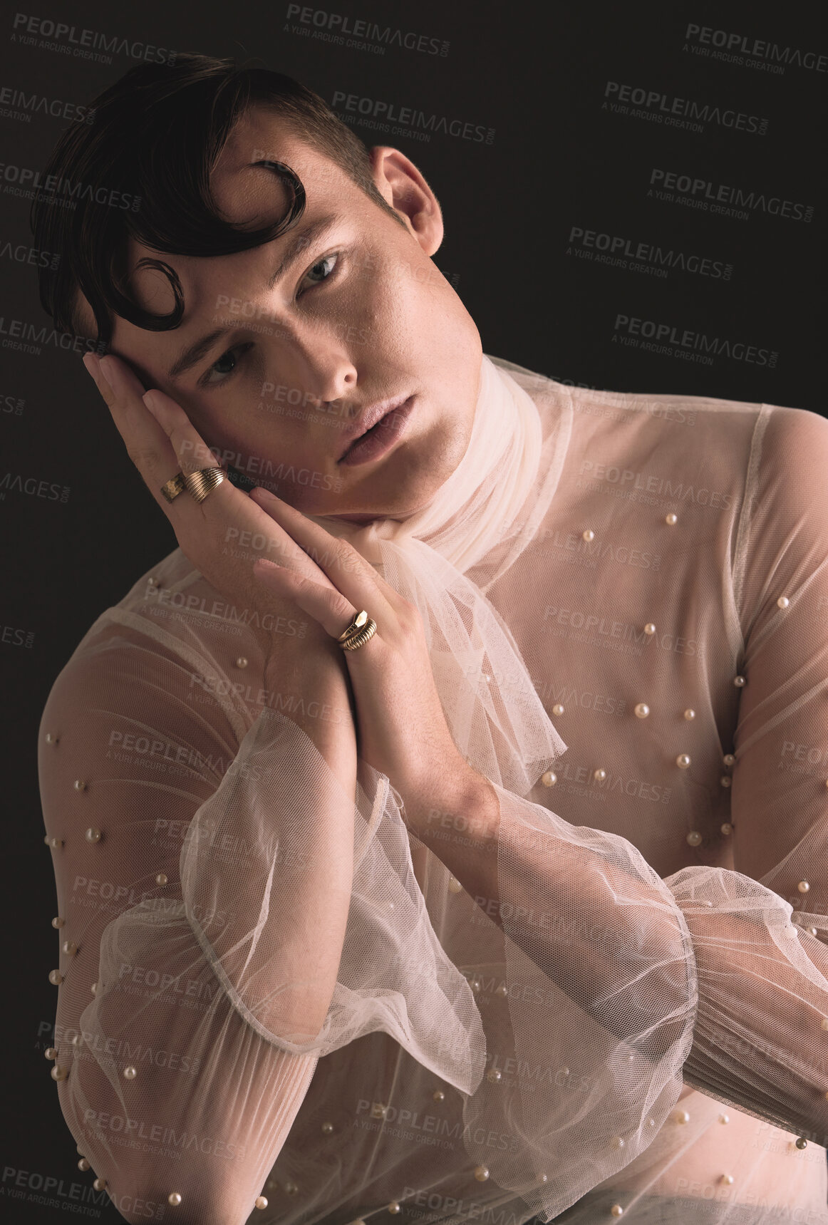 Buy stock photo Gender neutral, vintage fashion and portrait of person with designer clothing and faux pearls in studio. Isolated, black background and lgbtq or gay model with jewelry and creativity and non binary 