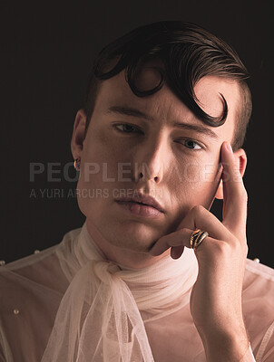 Buy stock photo Queer, beauty portrait and man isolated on dark background for fashion, creative vision and elegant transgender or cross dressing. UK model or person face for lgbtq, cosmetics and makeup in studio