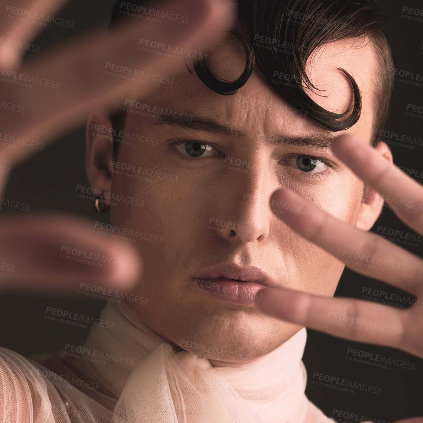 Buy stock photo Beauty portrait of transgender man isolated on dark background for creative and queer fashion aesthetic. Young lgbtq model or gay person face with cosmetics, makeup and hands for art style in studio