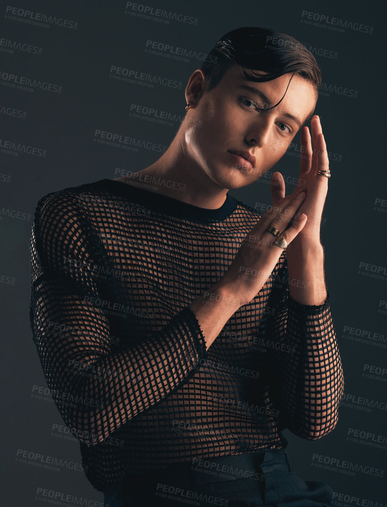 Buy stock photo Gender neutral, face and fashion, portrait on dark background and trendy, edgy with hands. Creative, gen z and beauty, sexy and cosmetics with serious non binary person in designer clothes