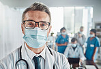 Covid, leadership and portrait of doctor, man in hospital for support, success and help in medical work. Health, wellness and medicine, confident mature professional with stethoscope, mockup and mask