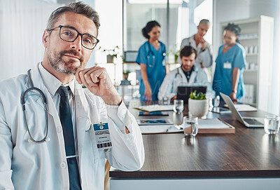 Buy stock photo Healthcare, confidence and portrait of senior doctor at desk in hospital for support, teaching and medical students. Health, medicine and leadership confident, mature and mentor, man with stethoscope