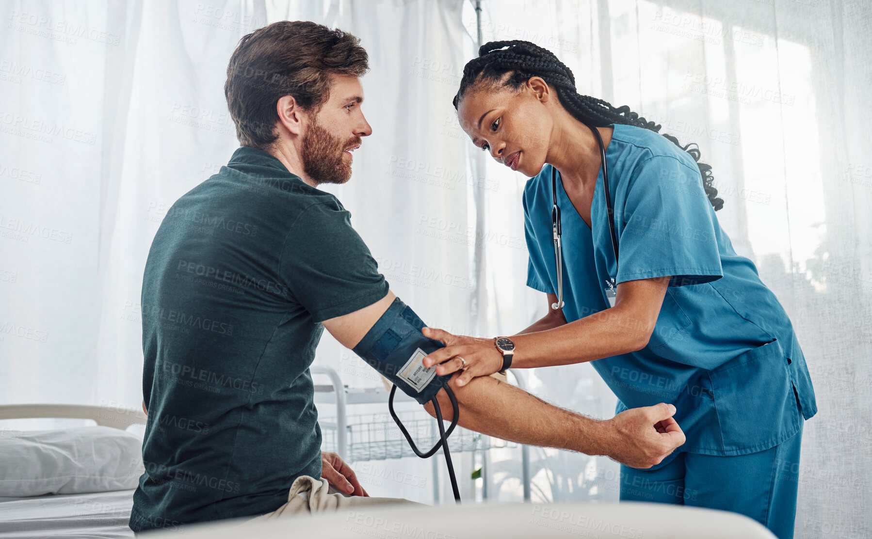 Buy stock photo Nurse, doctor and man with blood pressure test in hospital for heart health or wellness. Healthcare, hypertension consultation and medical physician with patient for examination with sphygmomanometer